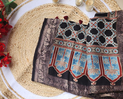Ajrakh print Dola silk Sarees-  Stripes and Elephant zari border Black