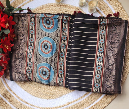 Ajrakh print Dola silk Sarees-  Stripes and Elephant zari border Black
